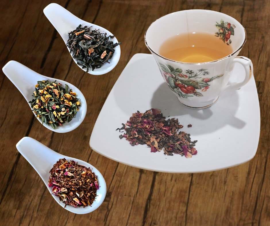 Teacup with tasting spoons of different teas